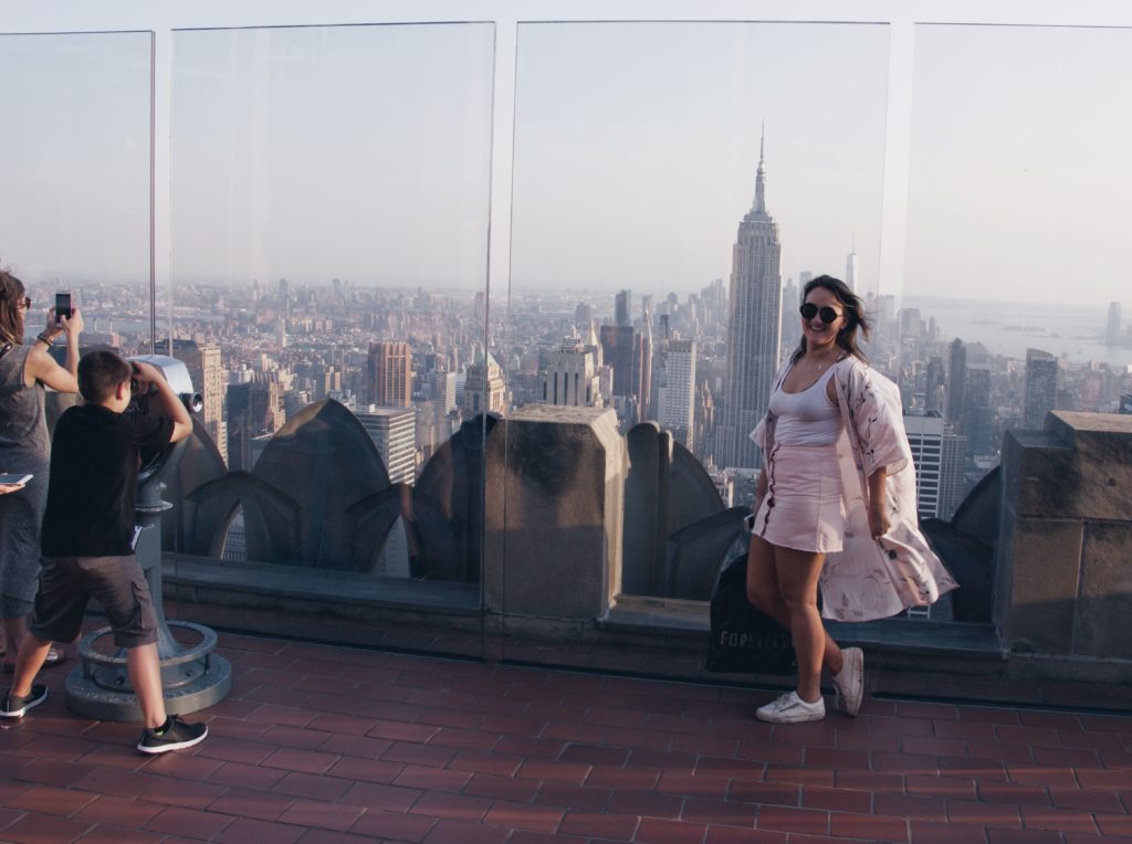 NYC in May- posing for a photo at top of the rock